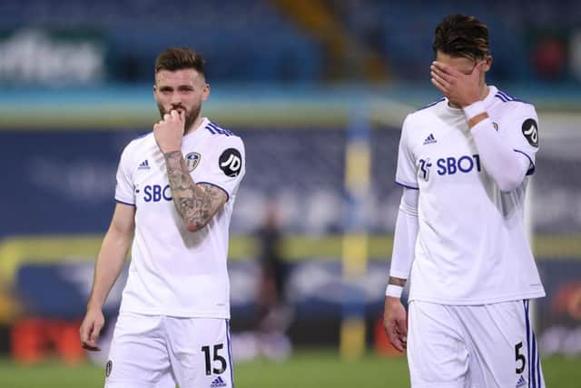 Stuart Dallas and Robin Koch show their dismay at full-time after defeat against Wolverhampton Wanderers at Elland Road.