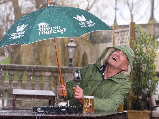 Larry Lamb battling the rain, delivering The Sipping Forecast to help the country navigate unpredictable pub-garden weather this spring.