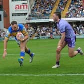 Cameron Smith scores for Leeds Rhinos against Warrington Wolves last season. Picture by Steve Riding.
