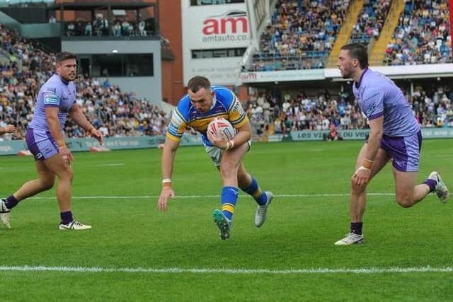 Cameron Smith scores for Leeds Rhinos against Warrington Wolves last season. Picture by Steve Riding.