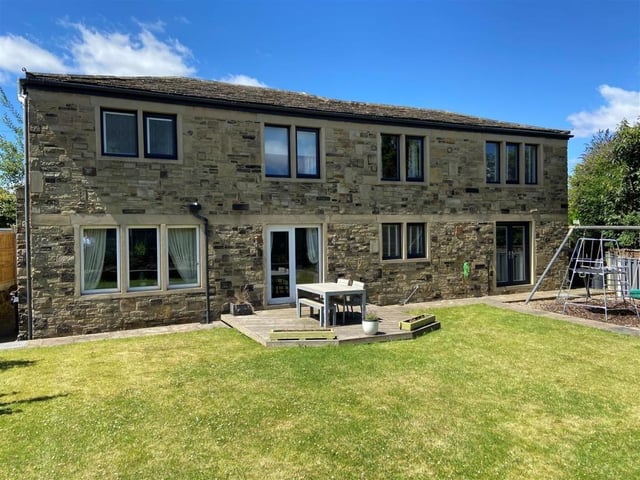 A sizeable lawned rear garden includes a patio for sitting out and entertaining.