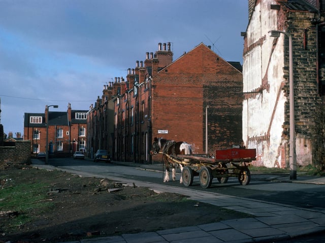 A horse and cart makes its way along Providence Road from the junction with Pennington Street.