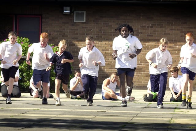 Sports co-ordinator Steve Walker puts pupils through their paces on the bleep test at Cockburn High School in June 2001. Staff from Leeds Leisure services measured the fitness levels of pupils at the start of the six week 'Slam It' health programme to compare the results at the end of the course.
