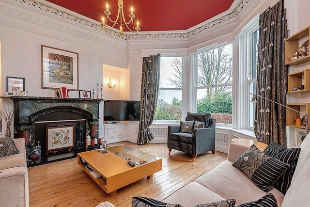 The spacious lounge has impressive character features including; high ceilings, ceiling rose, feature coving, oak flooring, a large sash style bay window and a feature fireplace.