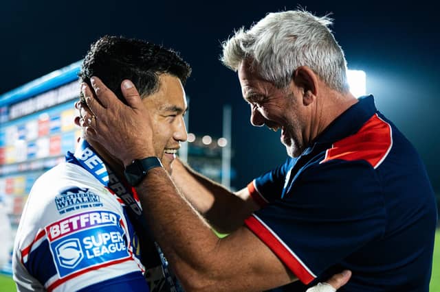 Wakefield Trinity coach Daryl Powell celebrates with Mason Lino whose last-gasp drop goal sealed a 15-14 win against Leeds Rhinos. Picture by Alex Whitehead/SWpix.com.