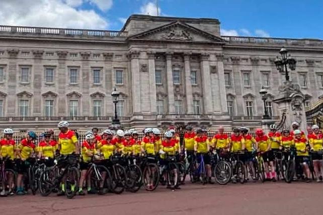 Riders outside Buckingham Palace.