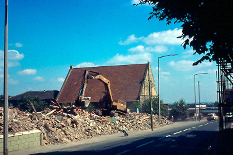 The New Inn was located on Town Street. It was demolished during the 1970s to make way for redevelopment. The only one still standing is the Trinity Methodist Church. A digger can be seen working amongst the rubble. This area is now Westover Close.