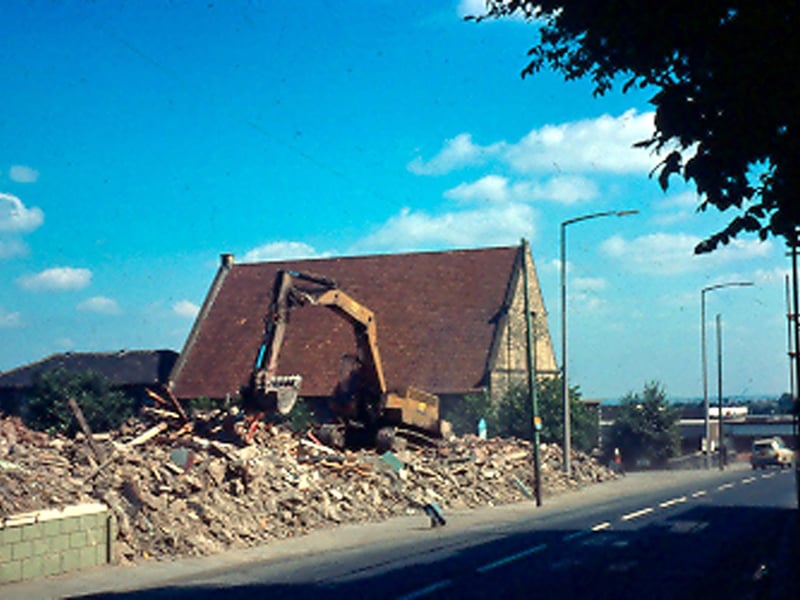 The New Inn was located on Town Street. It was demolished during the 1970s to make way for redevelopment. The only one still standing is the Trinity Methodist Church. A digger can be seen working amongst the rubble. This area is now Westover Close.