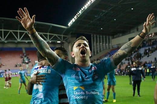 Richie Myler leads the celebrations after Rhinos' win at Wigan last week. Picture by Ed Sykes/SWpix.com.