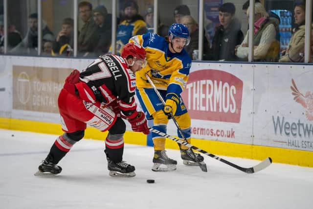 COMING THROUGH: Leeds Knights' Oli Endicott, right, was a livewire all night and battles with Ben Nethersell during the first period. Picture courtesy of Oliver Portamento