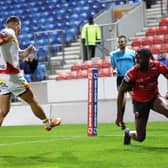 On-loan Wakefield Trinity winger Neil Tchamambe, right, celebrates scoring for Salford Red Devils against Catalans Dragons in September. Picture by John Clifton/SWpix.com.