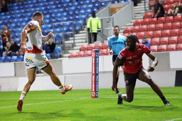 On-loan Wakefield Trinity winger Neil Tchamambe, right, celebrates scoring for Salford Red Devils against Catalans Dragons in September. Picture by John Clifton/SWpix.com.