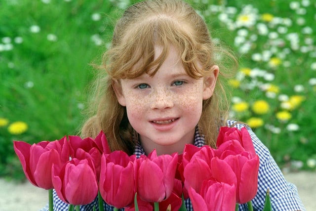 Whitkirk Primary School pupil Lauren Matthews holding the City of Leeds Tulip in May 1999.