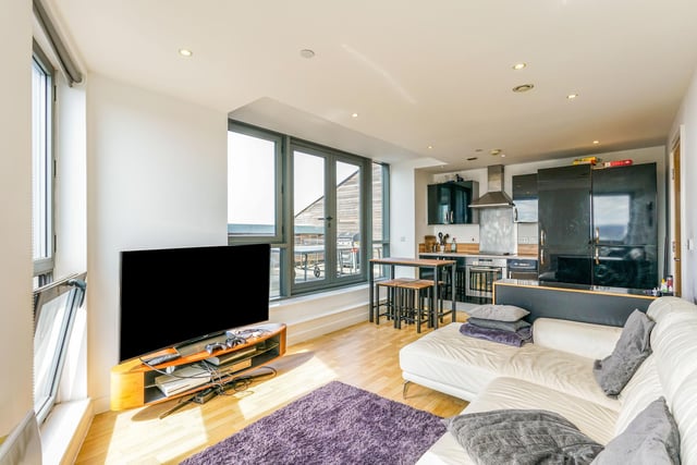 This two bed penthouse apartment in the heart of Leeds is on the market for £230,000. The property has an open plan light filled living area, boasting floor to ceiling windows leading to one of the largest private terraces in the building. This spacious apartment is located in the Echo Central One development with allocated secure underground parking.