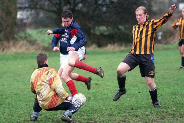 Rawdon's Lee Parr of Rawdon has his shot saved by FC Fox goalkeeper Mark Sneiders during a Wharfedale Sunday League PC Sports League Cup clash in December 1998.