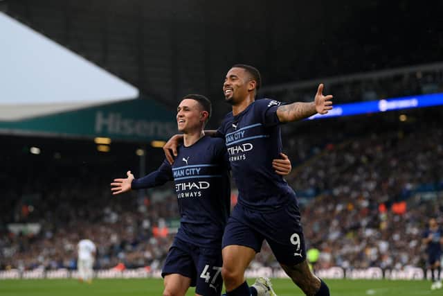 LEEDS, ENGLAND - APRIL 30: Gabriel Jesus of Manchester City celebrates with team mate Phil Foden after scoring their sides third goal during the Premier League match between Leeds United and Manchester City at Elland Road on April 30, 2022 in Leeds, England. (Photo by Michael Regan/Getty Images)