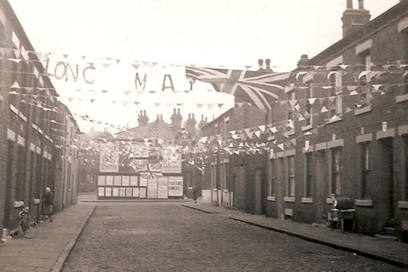 Photograph by Woodhouse resident Herbert Thompson showing decorations and bunting stretching across Ashfield Street in celebration of the coronation of Queen Elizabeth II in June 1953.
