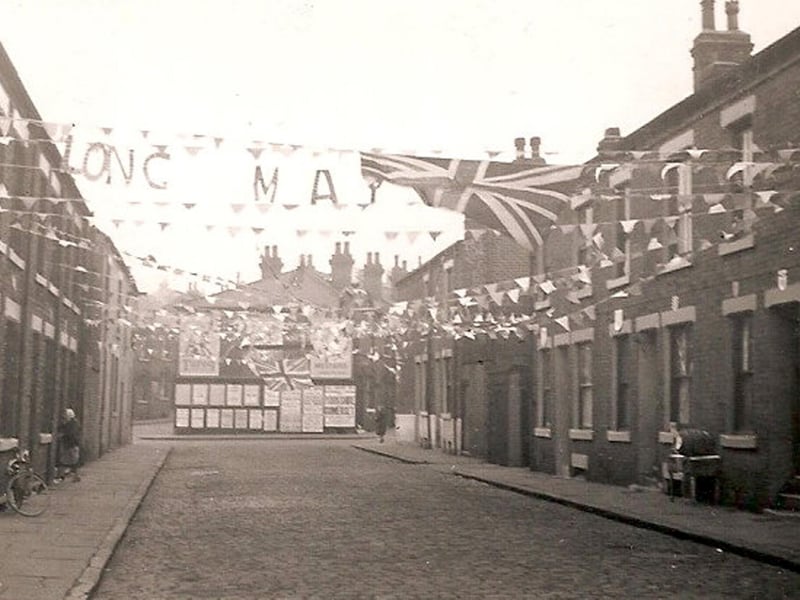 Photograph by Woodhouse resident Herbert Thompson showing decorations and bunting stretching across Ashfield Street in celebration of the coronation of Queen Elizabeth II in June 1953.