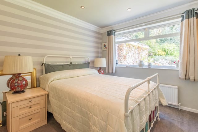 To the rear are two double bedrooms, with the master bedroom offering access to a private decking area which is perfect for enjoying breakfast al fresco.