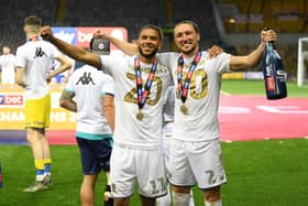 WHITES HIGH: Tyler Roberts, centre, celebrates Leeds United's promotion as Championship champions with Luke Ayling. Photo by Michael Regan/Getty Images.
