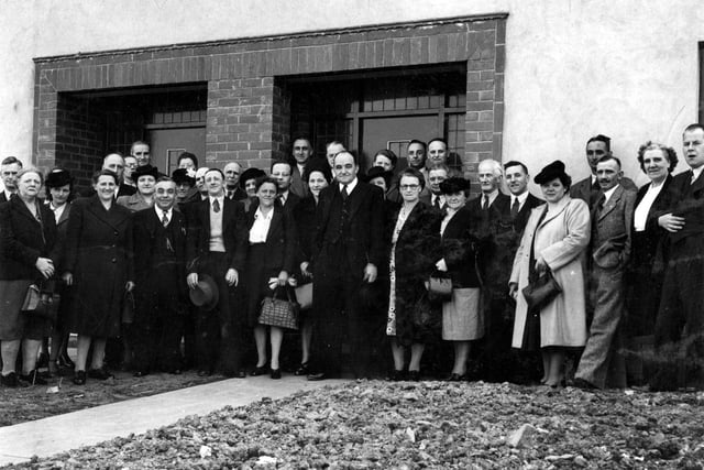 A group portrait for the official opening of the 100th Post War traditional house showing councillors and officials present. Pictured in May 1948.