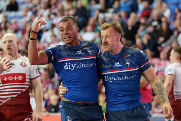 Corey Hall celebrates scoring a try at Wigan. Photo by John Clifton.