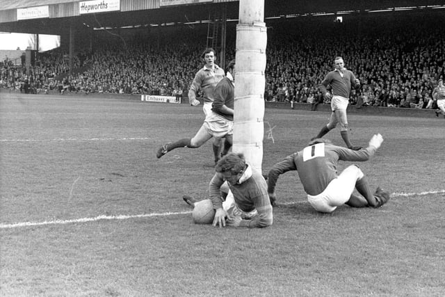 Mick Shoebottom scores a try for Leeds against Hull Kingston Rovers with Rose and Coupland of Hull failing to stop him. Although the try was disallowed Leeds won by 47-5. The other Leeds player in the background is Bernard Watson.