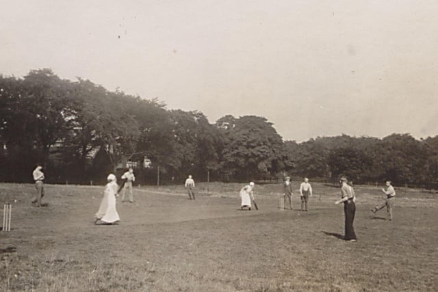 A game of cricket taking place in the grounds of Gledhow Hall in August 1915 while it was being used as a military hospital during the First World War. A team of nurses, seen here batting, are taking on a team of patients from the hospital.