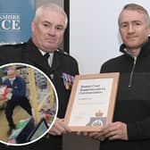 Christopher Bruce (right) receiving his award from Chief Superintendent Steve Dodds