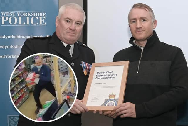 Christopher Bruce (right) receiving his award from Chief Superintendent Steve Dodds