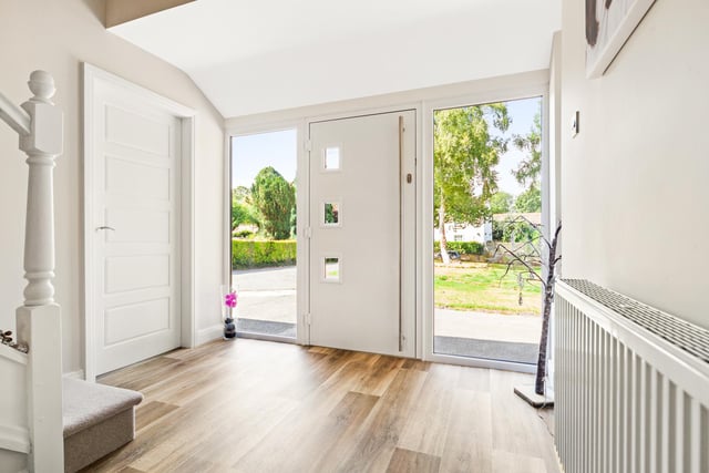 A bright and airy entrance hallway leads to all ground floor accommodation, stairs to the first floor, and access to a convenient downstairs toilet.