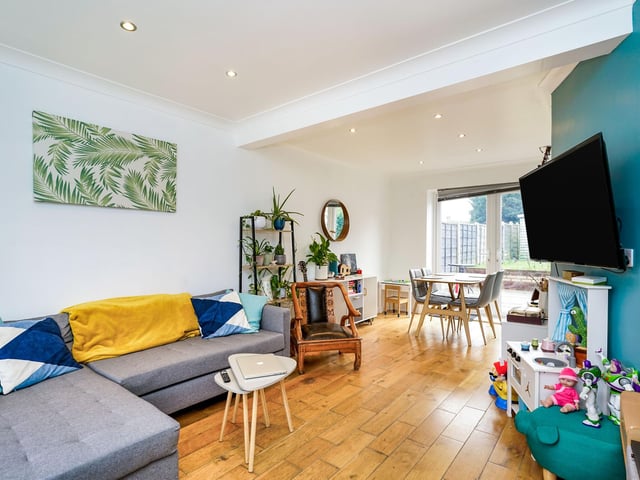 The combined living and dining room next door is a bright and spacious area within the property.