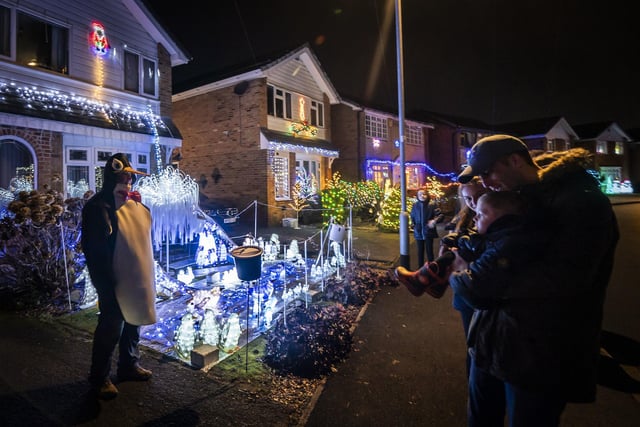 Each house on the lane becomes a beacon of light, as neighbours celebrate the festive season.