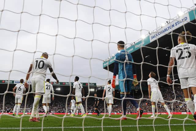 LEEDS, ENGLAND - SEPTEMBER 12: Raphinha, Illan Meslier and Kalvin Phillips of Leeds United look dejected after conceding their side's second goal scored by Fabinho of Liverpool (not pictured) during the Premier League match between Leeds United and Liverpool at Elland Road on September 12, 2021 in Leeds, England. (Photo by Shaun Botterill/Getty Images)