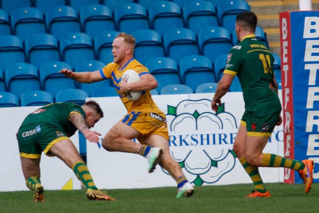 Craig McShane on the attack for Hunslet ARLFC during this year's Grand Final win over West Hull. Picture by Alex Shenton.