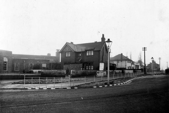 The  police station at on junction of Cross Gates Road with Station Road, now demolished. On the left Crossgates library can be seen which is on Farm Road opened in 1939. Blackout markings can be seen on kerb edge. Pictured in January 1940.