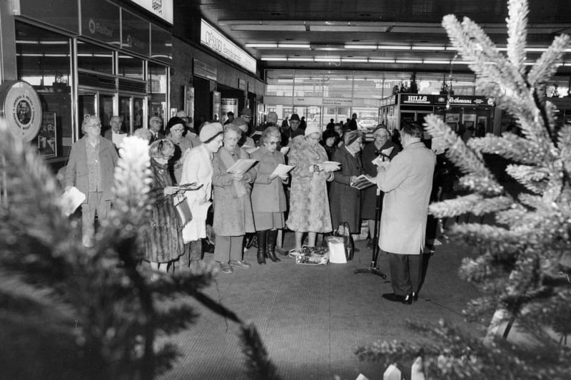Carol singing at Leeds City Station in December 1982 for Leeds Council for Voluntary Services Christmas Appeal.