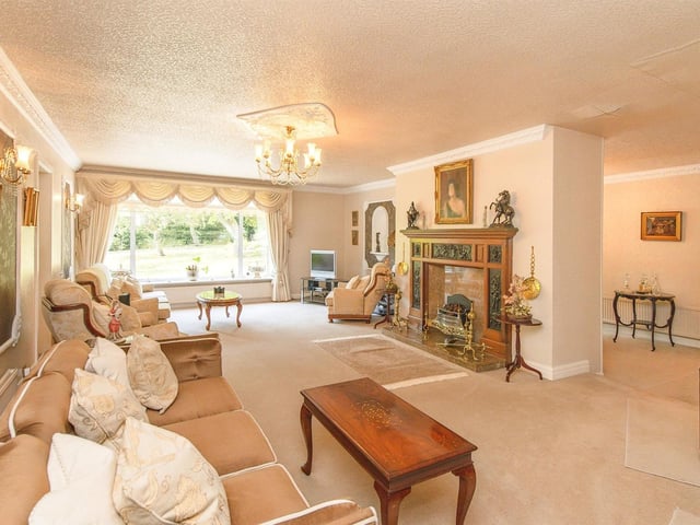 The bespoke fireplace is a focal point of the comfortable lounge.