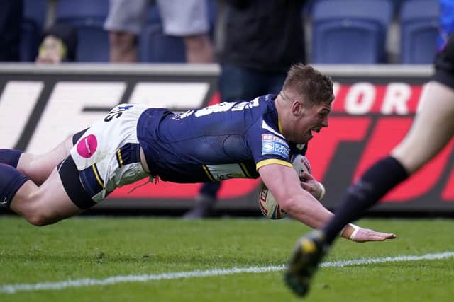 Tom Holroyd scores for Rhinos against Catalans. Picture by Danny Lawson/PA Wire.