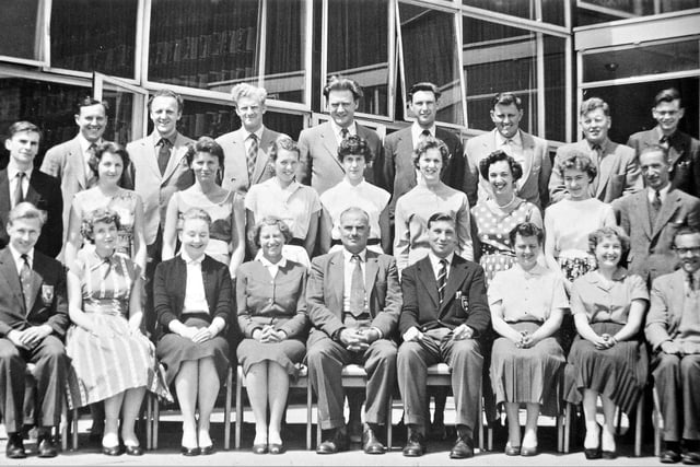 This black and white photo shows the staff of Woodkirk Secondary School in July 1959. Do you recognise anyone?