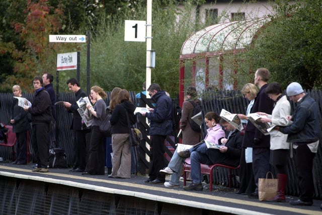 Fed up commuters wait at Burley Station for the next train into Leeds in October 2003.