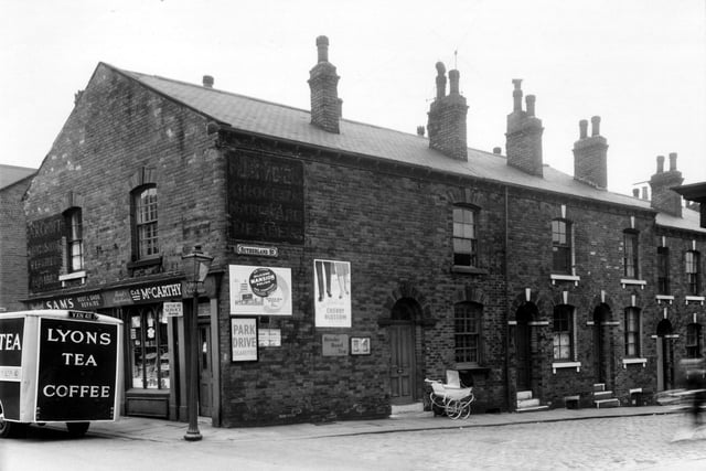 Two shops on Green Lane, partially obscured by a Lyons tea and coffee delivery van. They are Sam's boot and shoe repairs and a grocers. The photo dates back to May 1959.