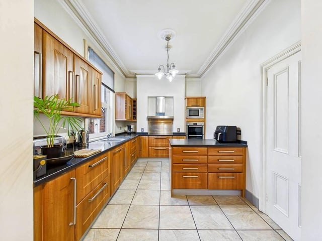 The kitchen features a range of high and low level kitchen units with breakfast bar. There's also a variety of integrated appliances such as a double oven, a microwave and an extractor hood.