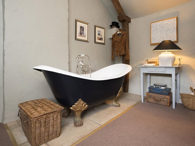 A refurbished bathroom, with claw foot bath,