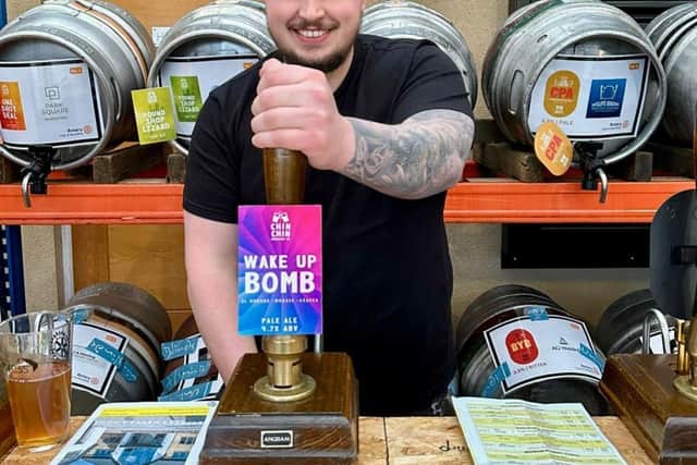 Matt Short, Morley Glass’s Order Logistics Manager, pulls a pint at a previous beer festival.