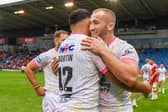 Jarrod O’Connor, right, celebrates with teammate Rhyse Martin after Rhinos' victory at Salford. Picture by Olly Hassell/SWpix.com.