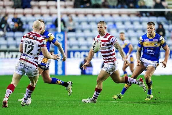 Cade Cust, pictured facing camera during Wigan's home league win over Leeds last year, is back in contention after injury. Picture by Alex Whitehead/SWpix.com.