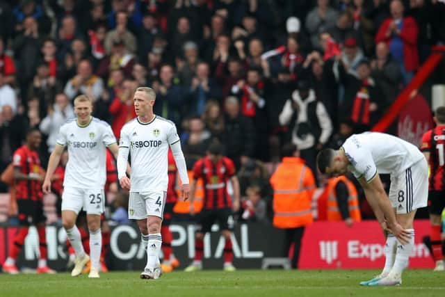 (L-R0 Leeds United's Danish defender Rasmus Kristensen, Leeds United's English midfielder Adam Forshaw and Leeds United's Spanish midfielder Marc Roca react to conceding their fourth goal vs Bournemouth (Photo by STEVE BARDENS/AFP via Getty Images)