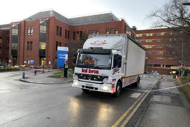 A recovery truck leaves St James's Hospital, after a Leeds man was arrested on suspicion of firearms and explosives offences