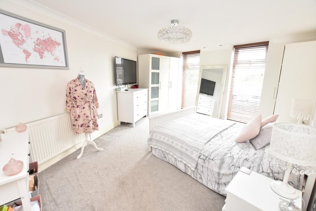 An occasional attic room is accessed by a drop-down ladder and is carpeted and fitted with hanging rails for extra storage. The CCTV and gas central heating boiler are also housed here.